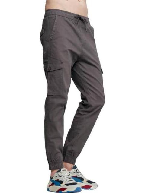 PANTALON BOLSAS DIAGONALES GRIS NEXT CO